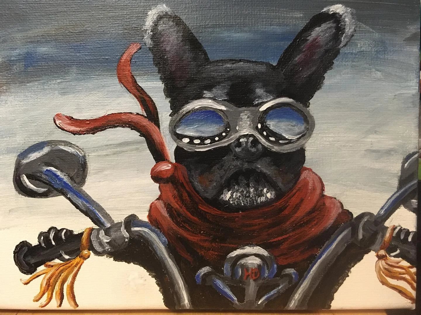 A dog wearing aviator goggles and a red scarf on a motorcycle